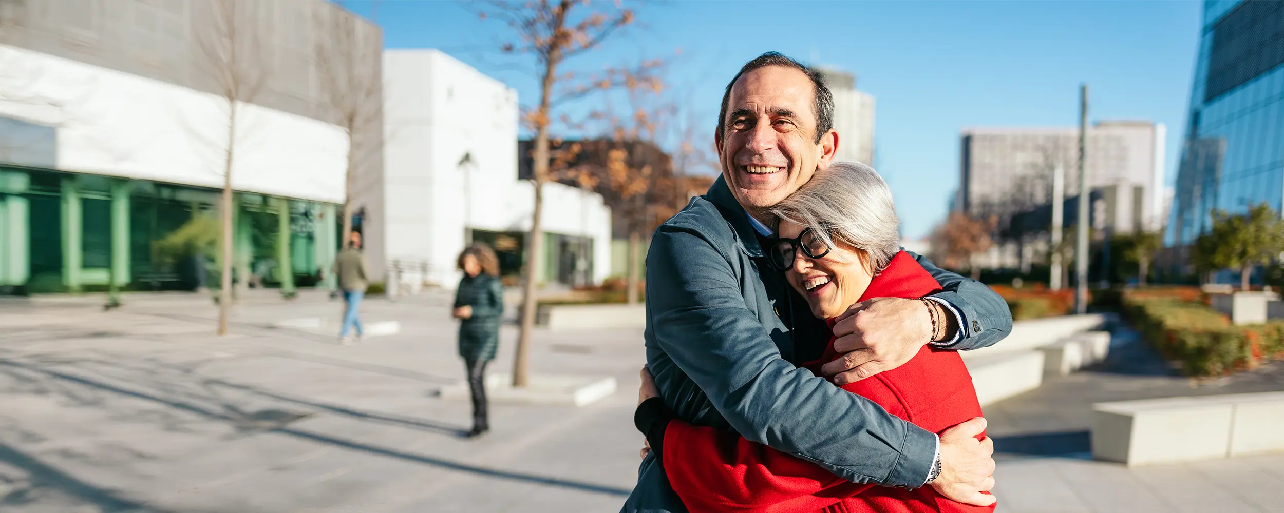 Seniors hugging an in-home care in San Antonio
